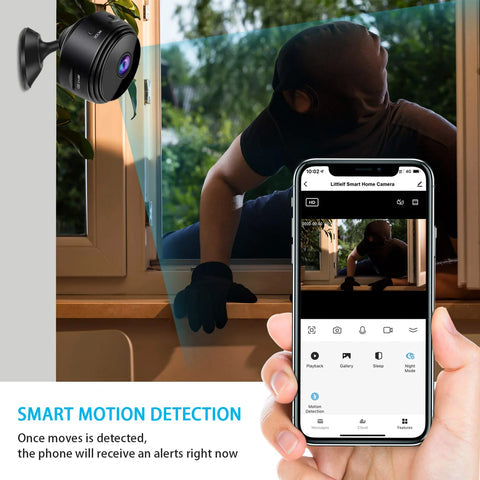 Smart home camera with motion detection feature displayed on a smartphone app, showing a person sitting by a window.