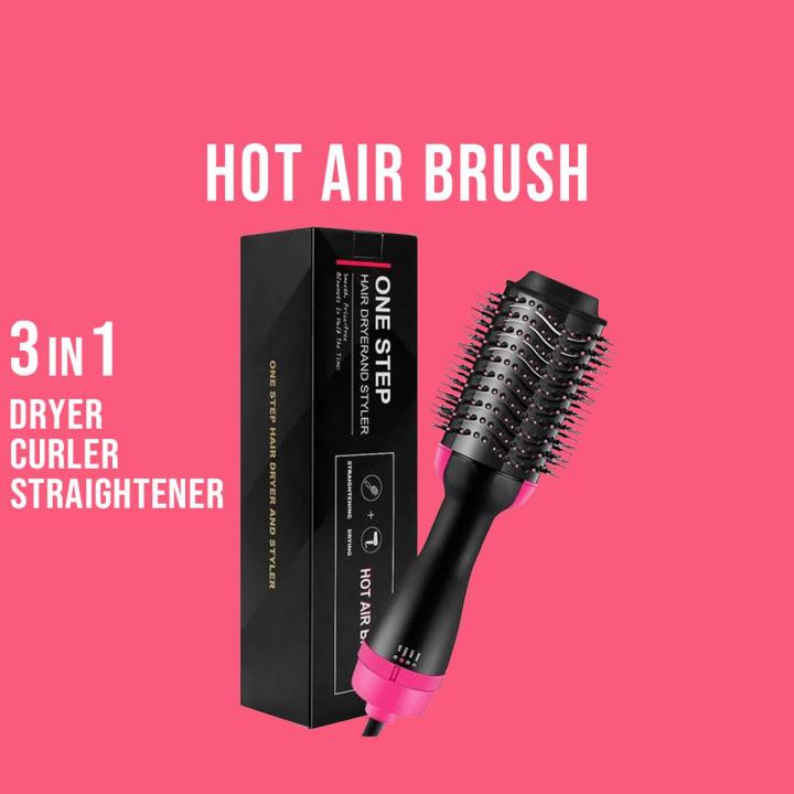 Black hot air brush with pink accents and packaging on a pink background