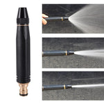 Black spray nozzle with water spraying onto a surface, shown from different angles.