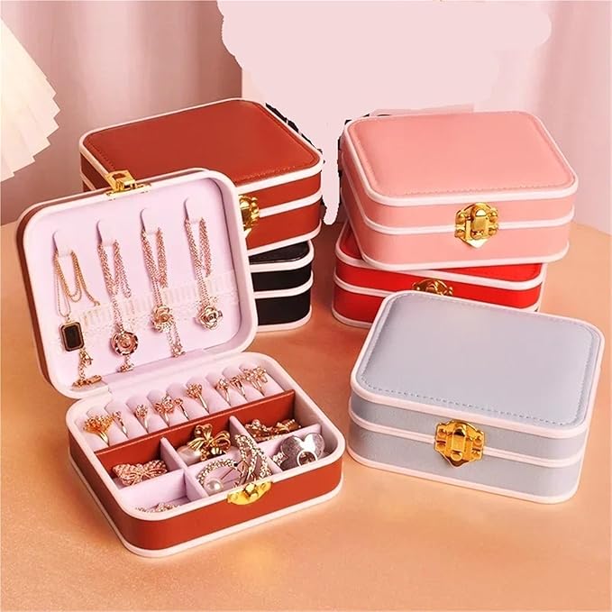 Jewelry organizer with jewelry items on a pink background