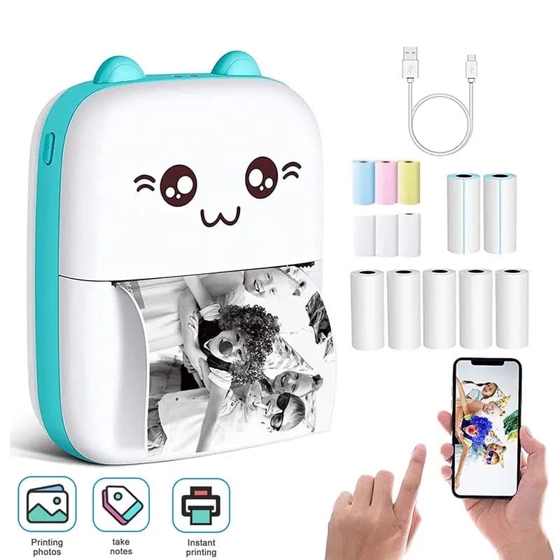 Small portable printer with cartoon face, ink cartridges, and smartphone displaying prints on a white background