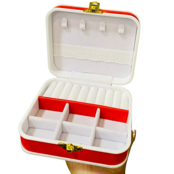 Red and white jewelry box with gold accents on a white background