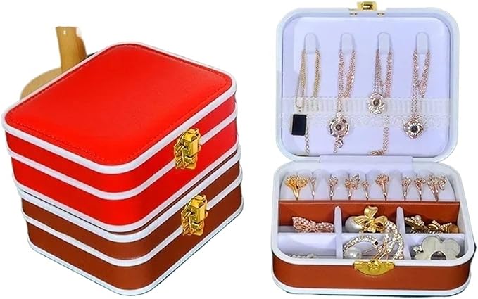 Red jewelry box with gold accents and an open lid revealing jewelry inside.