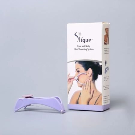 Slique face and body hair removal system with packaging on a gray background
