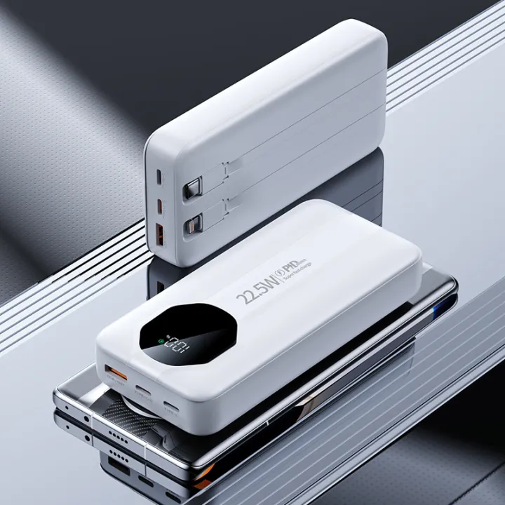 White power bank with digital display on a reflective surface