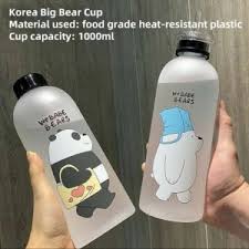Two transparent Big Bear Cups with cartoon characters on a wooden surface.