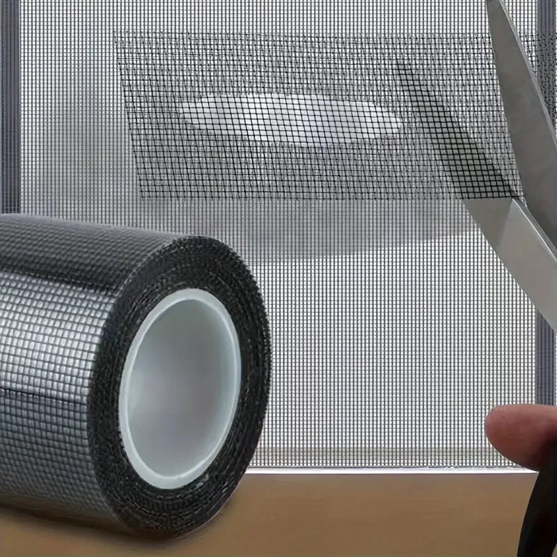 Roll of mesh material with scissors on a wooden surface